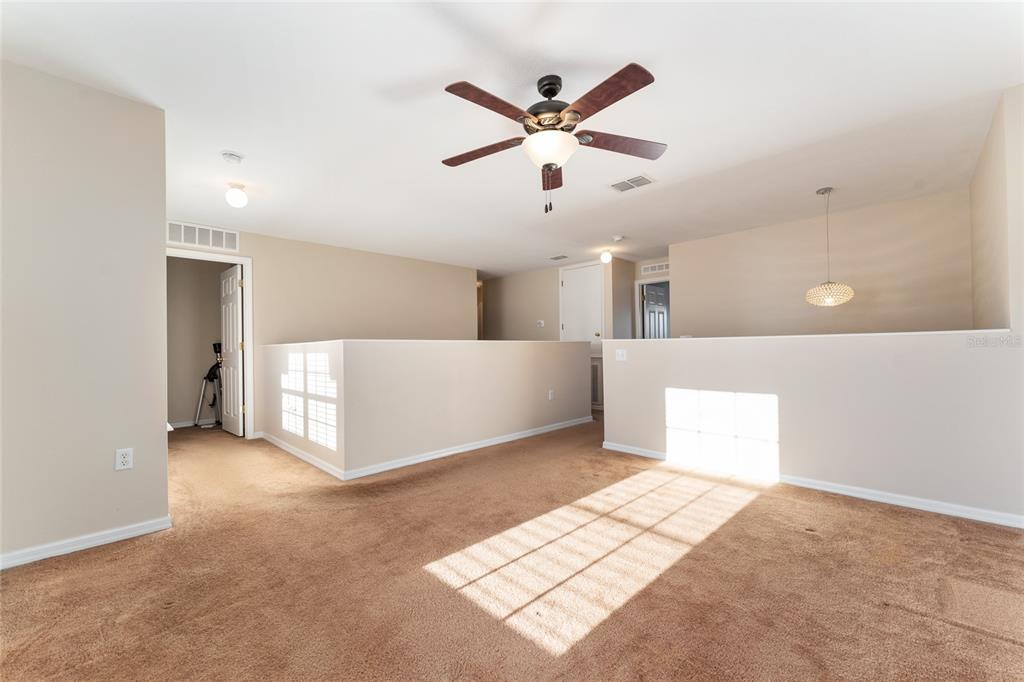 2661 Northeast 42nd Road Ocala, FL 34470 - Photo 46 of 74 a view of a livingroom with a ceiling fan and window