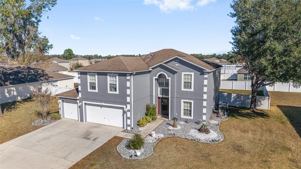 2661 Northeast 42nd Road Ocala, FL 34470 - Photo 5 of 74 a front view of a house with yard and outdoor seating