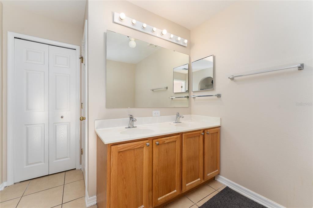 2661 Northeast 42nd Road Ocala, FL 34470 - Photo 52 of 74 a bathroom with a sink and a mirror