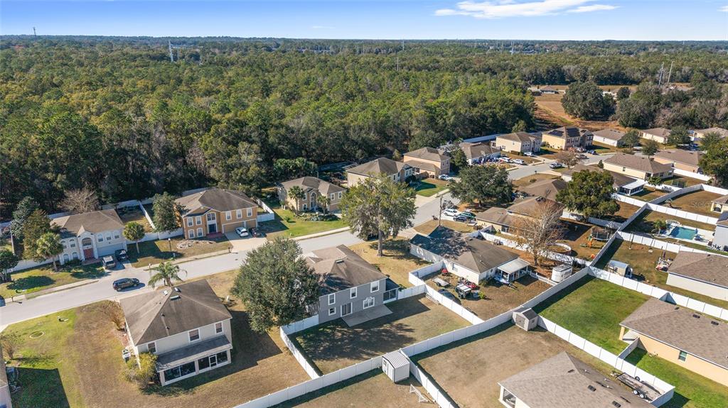 2661 Northeast 42nd Road Ocala, FL 34470 - Photo 59 of 74 an aerial view of residential houses with outdoor space
