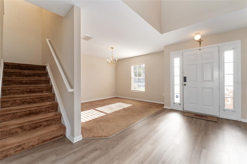 2661 Northeast 42nd Road Ocala, FL 34470 - Photo 10 of 74 wooden floor in an empty room with a window