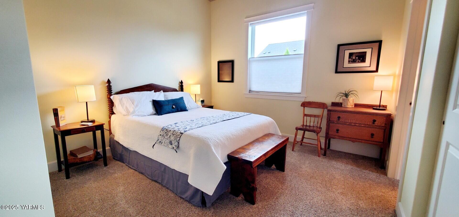 7106 Vista Ridge Avenue Yakima, WA 98903 - Photo 22 of 43 a bedroom with a bed and a table in it