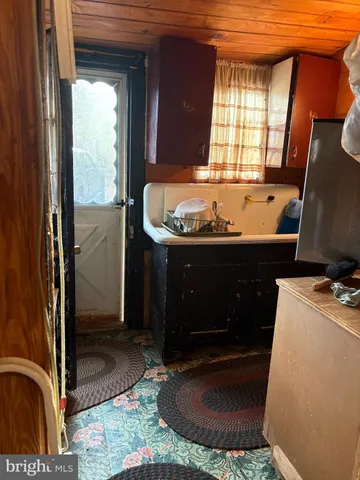 a room with fireplace and window