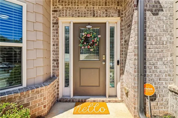 a front view of a house with a iron gate