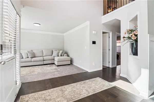 a living room with furniture and a rug