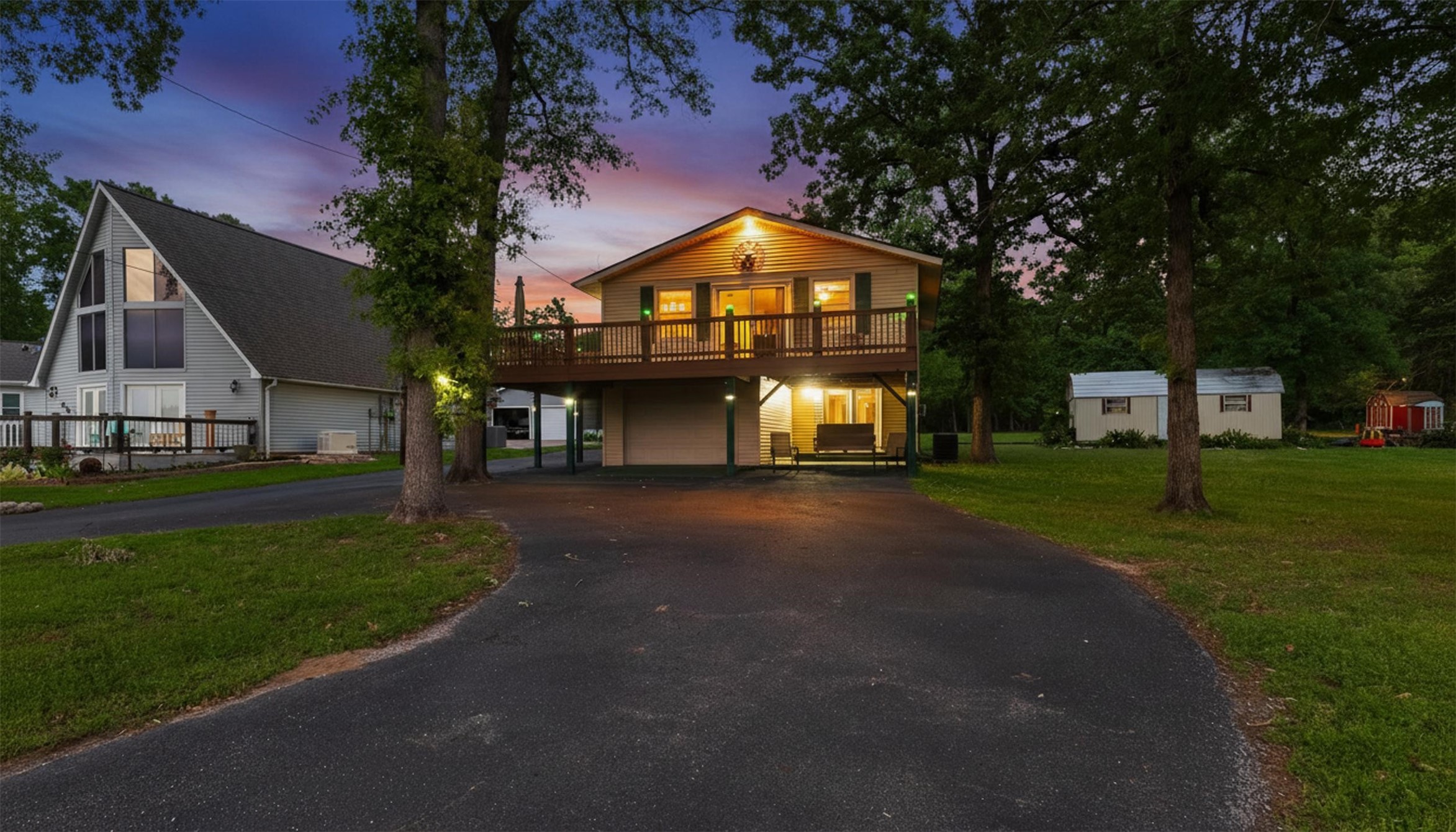 439 Lakeview Harbor Onalaska, TX 77360 - Photo 2 of 43 a view of a big house with a big yard and potted plants