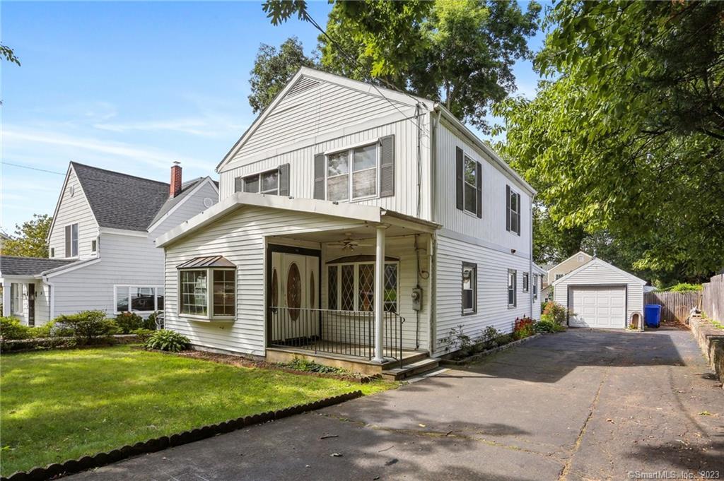 22 Ridgeview Avenue Darien, CT 06820 - Photo 1 of 1 a front view of a house with a yard