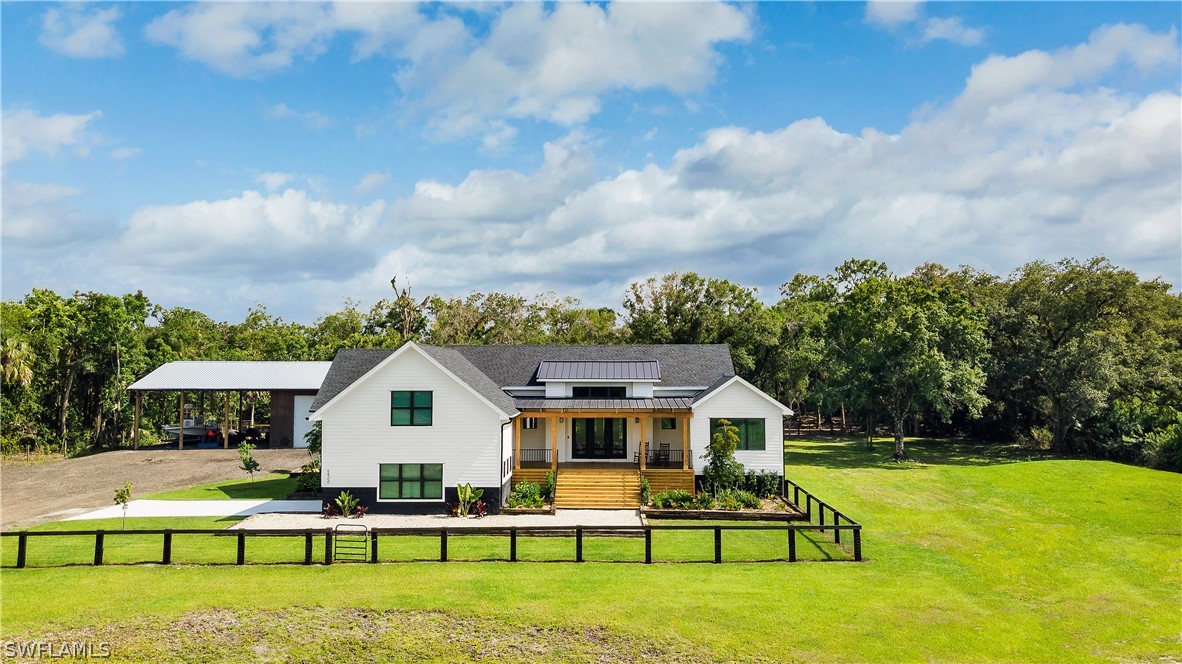 5400 Dana Road Fort Myers, FL 33905 - Photo 1 of 35 a front view of house with yard and patio