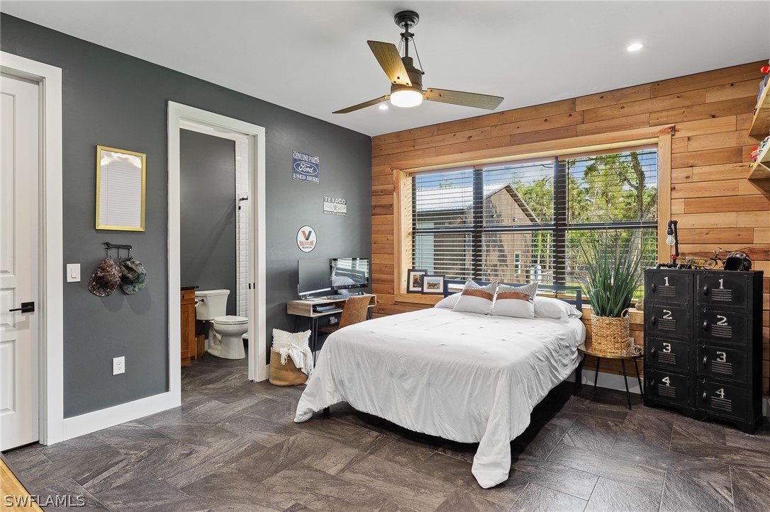 5400 Dana Road Fort Myers, FL 33905 - Photo 21 of 35 a bedroom with a bed and a large window