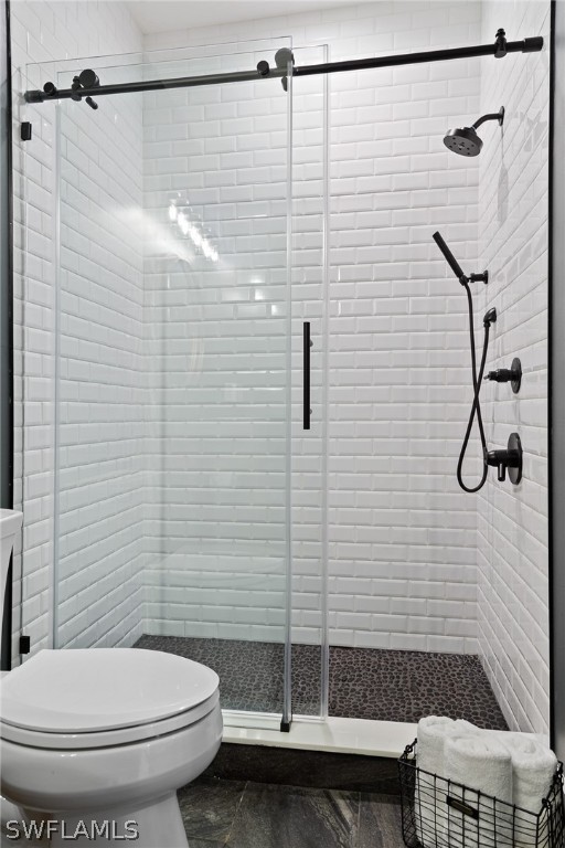 5400 Dana Road Fort Myers, FL 33905 - Photo 23 of 35 a bathroom with a toilet and a shower
