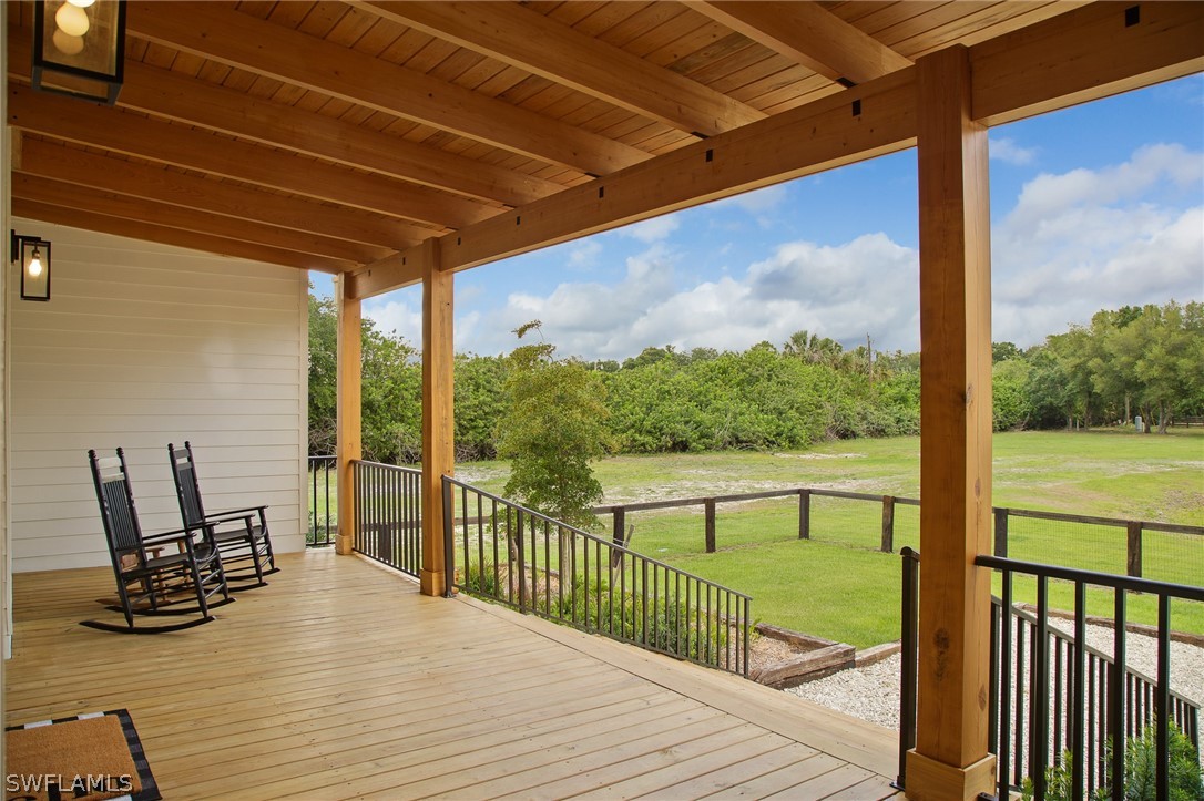 5400 Dana Road Fort Myers, FL 33905 - Photo 3 of 35 a view of a balcony with chair and wooden floor
