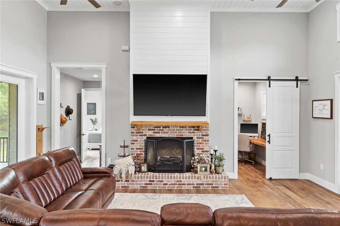 5400 Dana Road Fort Myers, FL 33905 - Photo 6 of 35 a living room with furniture and a fireplace