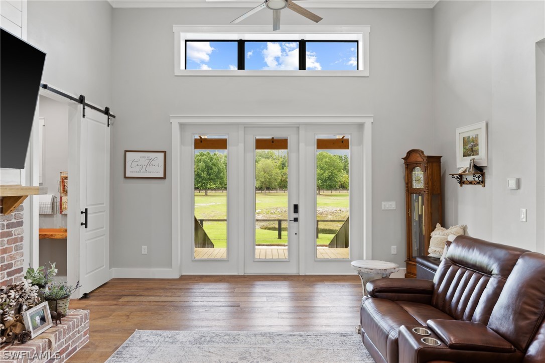 5400 Dana Road Fort Myers, FL 33905 - Photo 7 of 35 a view of an entryway with wooden floor and a livingroom