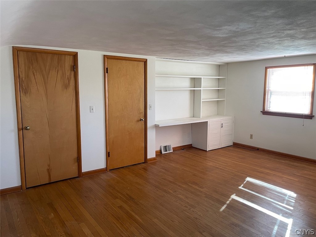 229 Willumae Drive Syracuse, NY 13208 - Photo 23 of 30 Upstairs bedroom #1 with 2 closets and built in de