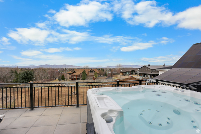1354 South 800 East Mapleton, UT 84664 - Photo 49 of 129 View of patio featuring a residential view, a hot tub, and a mountain view