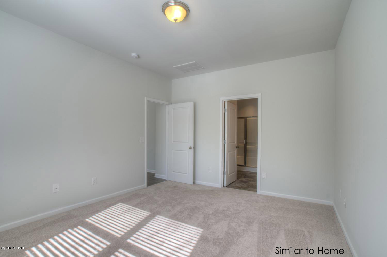 604 Saltree Circle, Unit 104 Holly Ridge, NC 28445 - Photo 8 of 21 Cali-large-010-4-Master Bedrooma