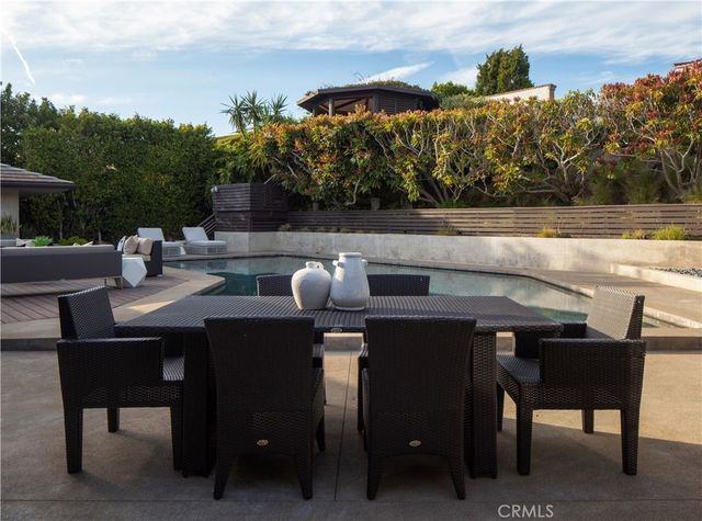 a outdoor dining space with furniture and mountain view