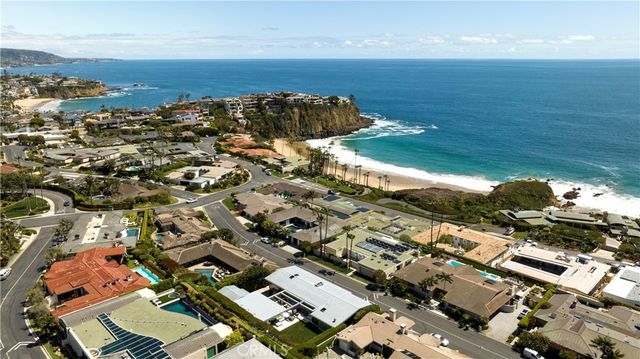 an aerial view of a city with ocean view
