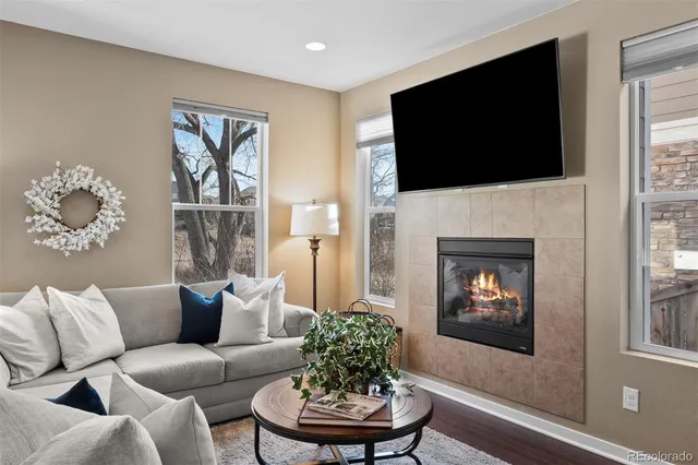 a living room with furniture fireplace and a flat screen tv