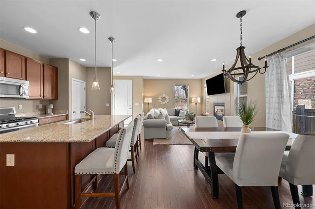 a view of kitchen with cabinets table and chairs