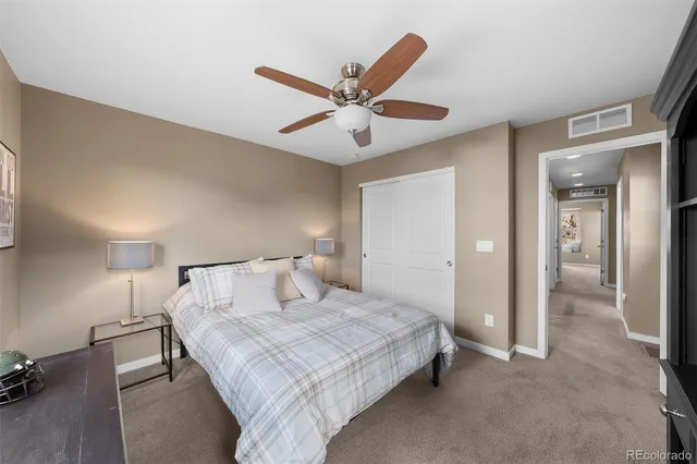 a bedroom with a bed and a table in it