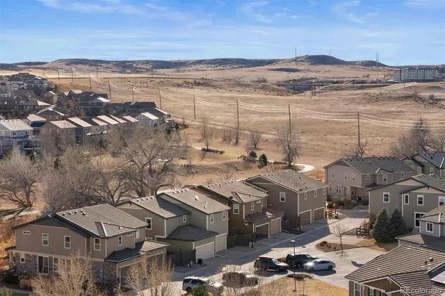 an aerial view of house with yard