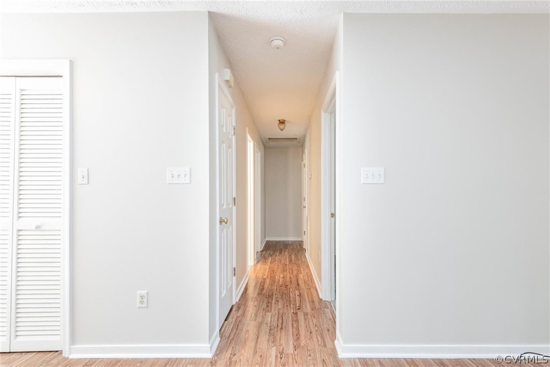 3137 Lowry Road Columbia, VA 23038 - Photo 15 of 26 a view of a hallway with wooden floor