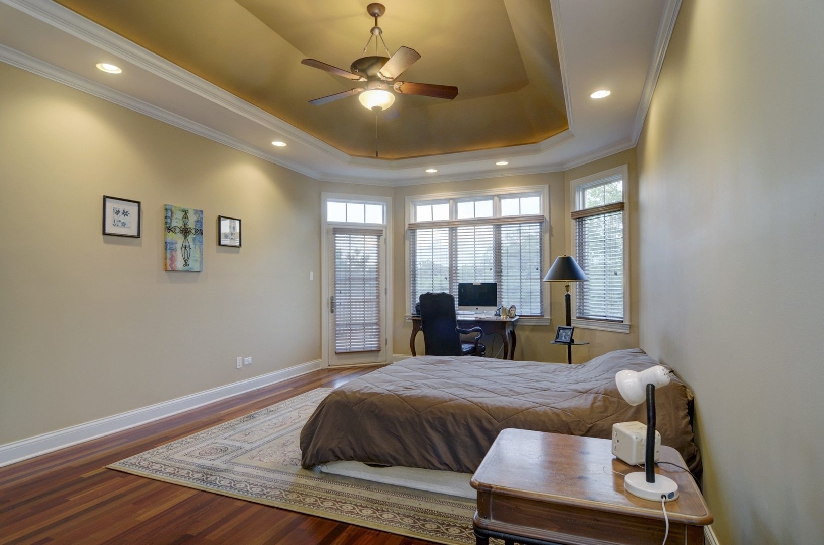510 Rookery Lane Joliet, IL 60431 - Photo 11 of 40 a spacious bedroom with a bed and a chandelier