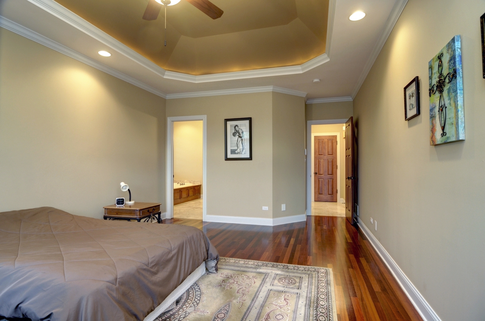 510 Rookery Lane Joliet, IL 60431 - Photo 12 of 40 a bedroom with a bed and a chandelier