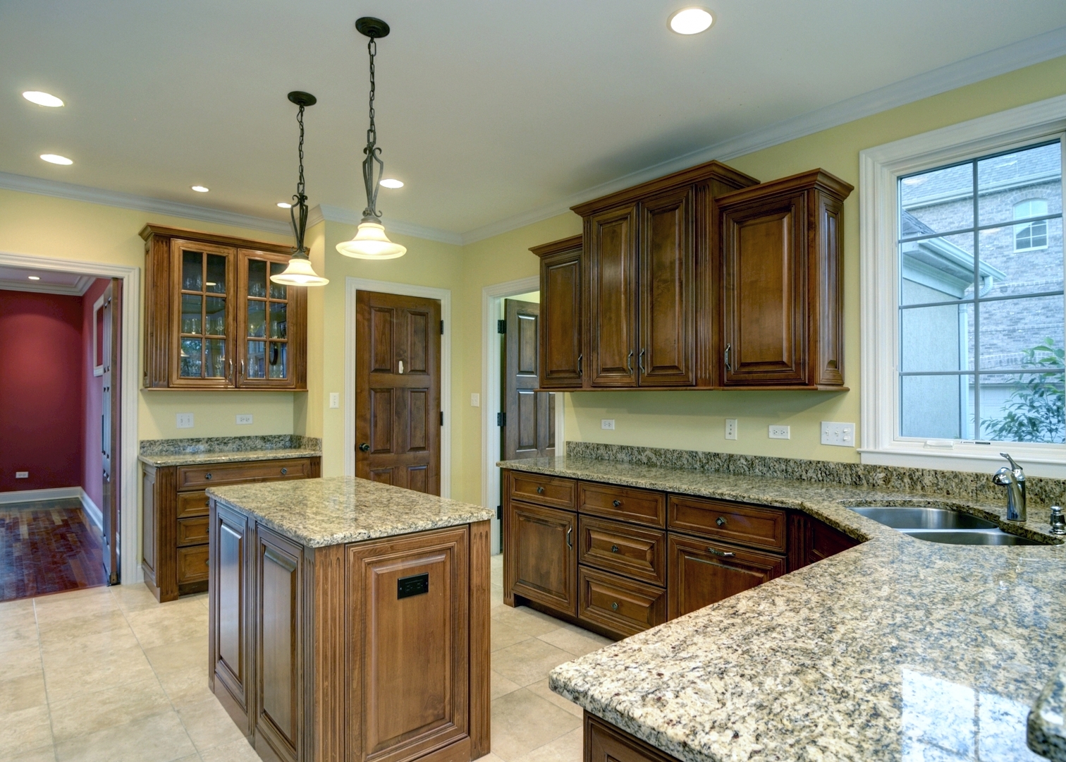 510 Rookery Lane Joliet, IL 60431 - Photo 16 of 40 a kitchen with a stove a sink and a wooden cabinets