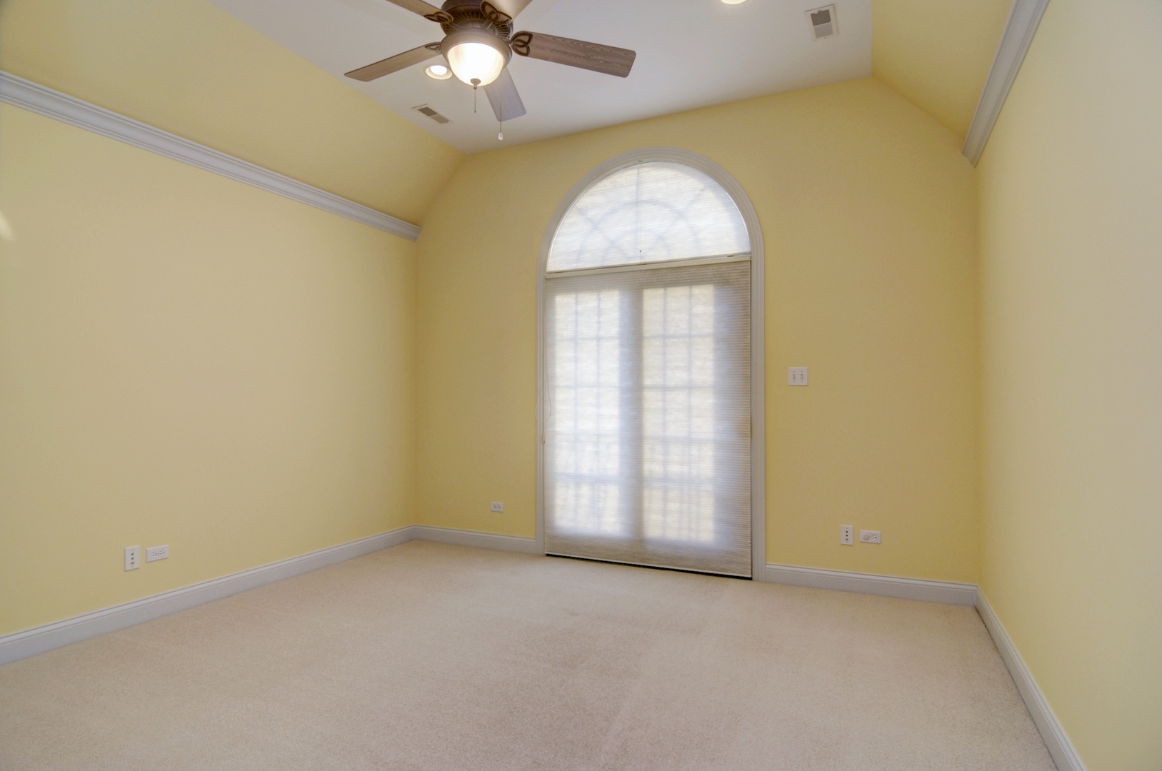 510 Rookery Lane Joliet, IL 60431 - Photo 31 of 40 an empty room with a chandelier fan and windows