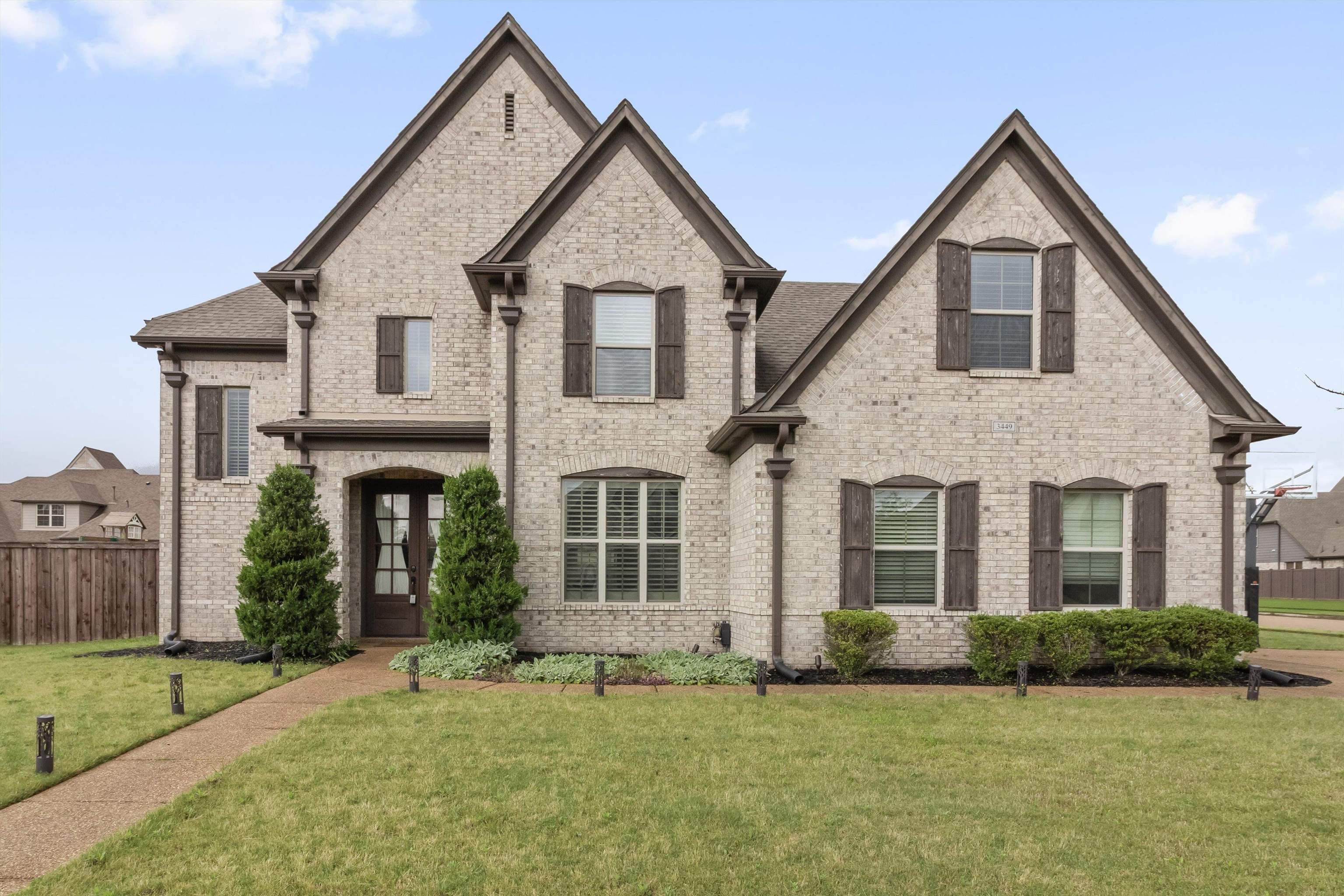 a front view of a house with a yard