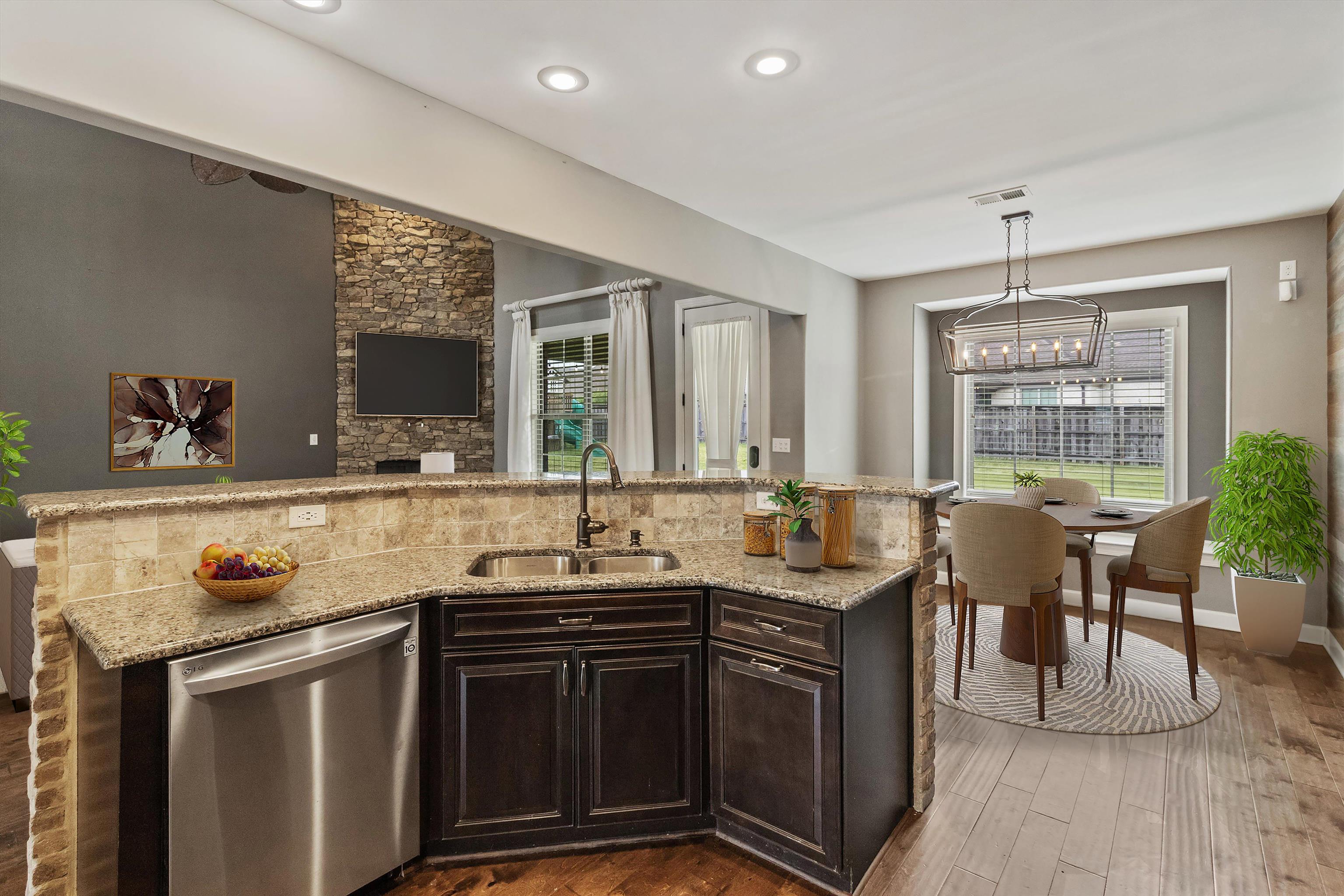 3449 Banyan Lane Bartlett, TN 38133 - Photo 15 of 35 a kitchen with granite countertop a sink and a stove