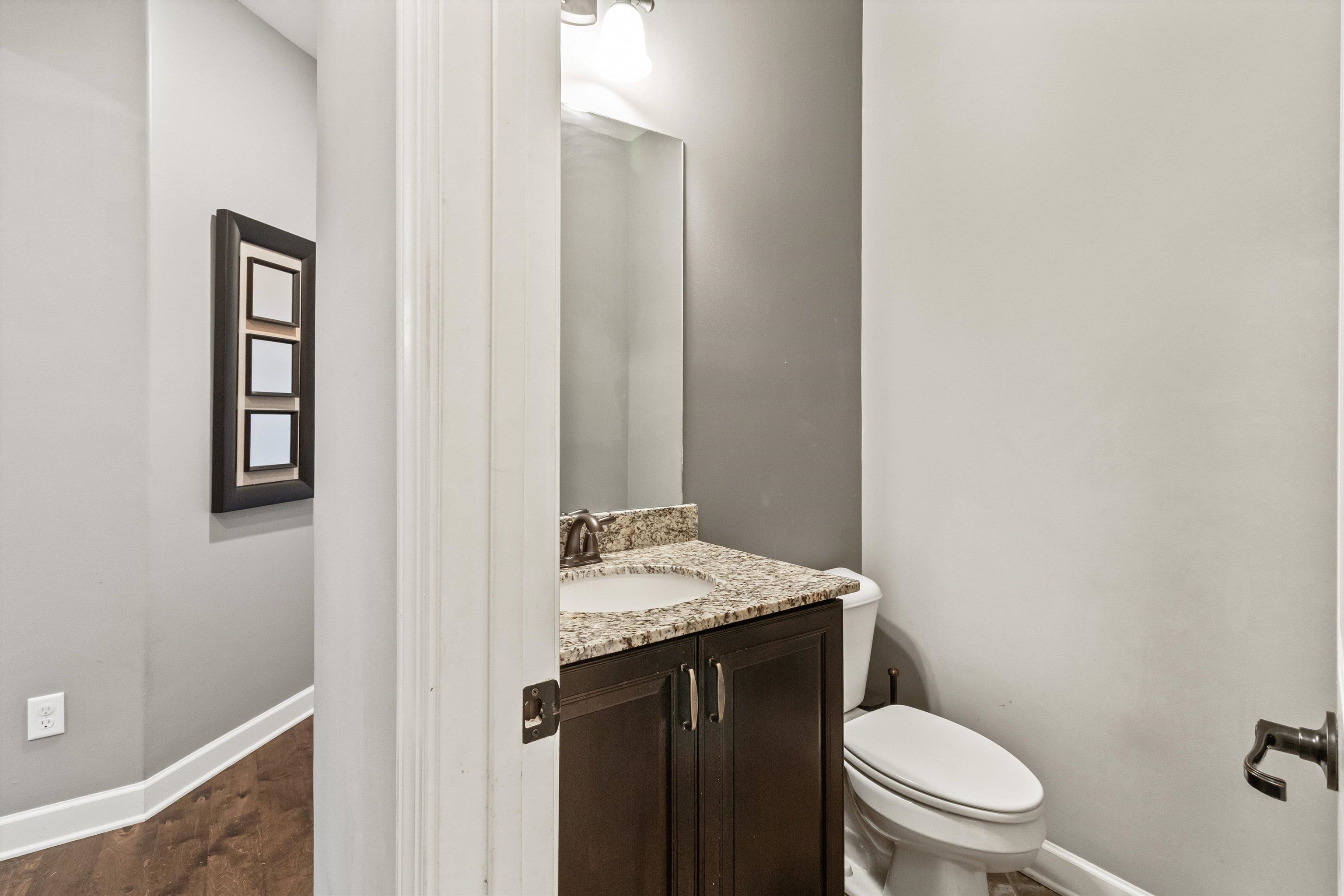 3449 Banyan Lane Bartlett, TN 38133 - Photo 18 of 35 a bathroom with a granite countertop sink toilet and mirror