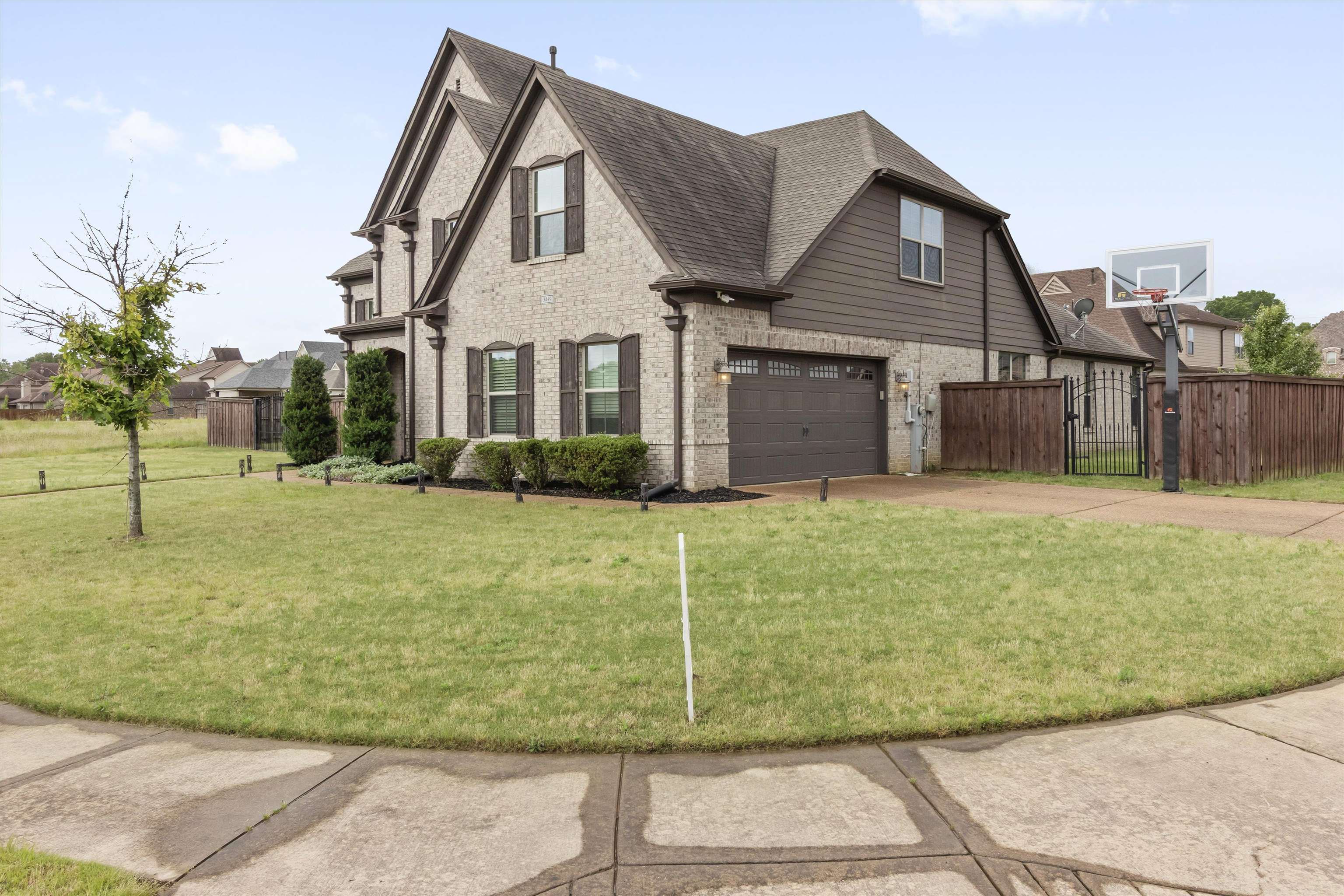 3449 Banyan Lane Bartlett, TN 38133 - Photo 2 of 35 a front view of a house with garden