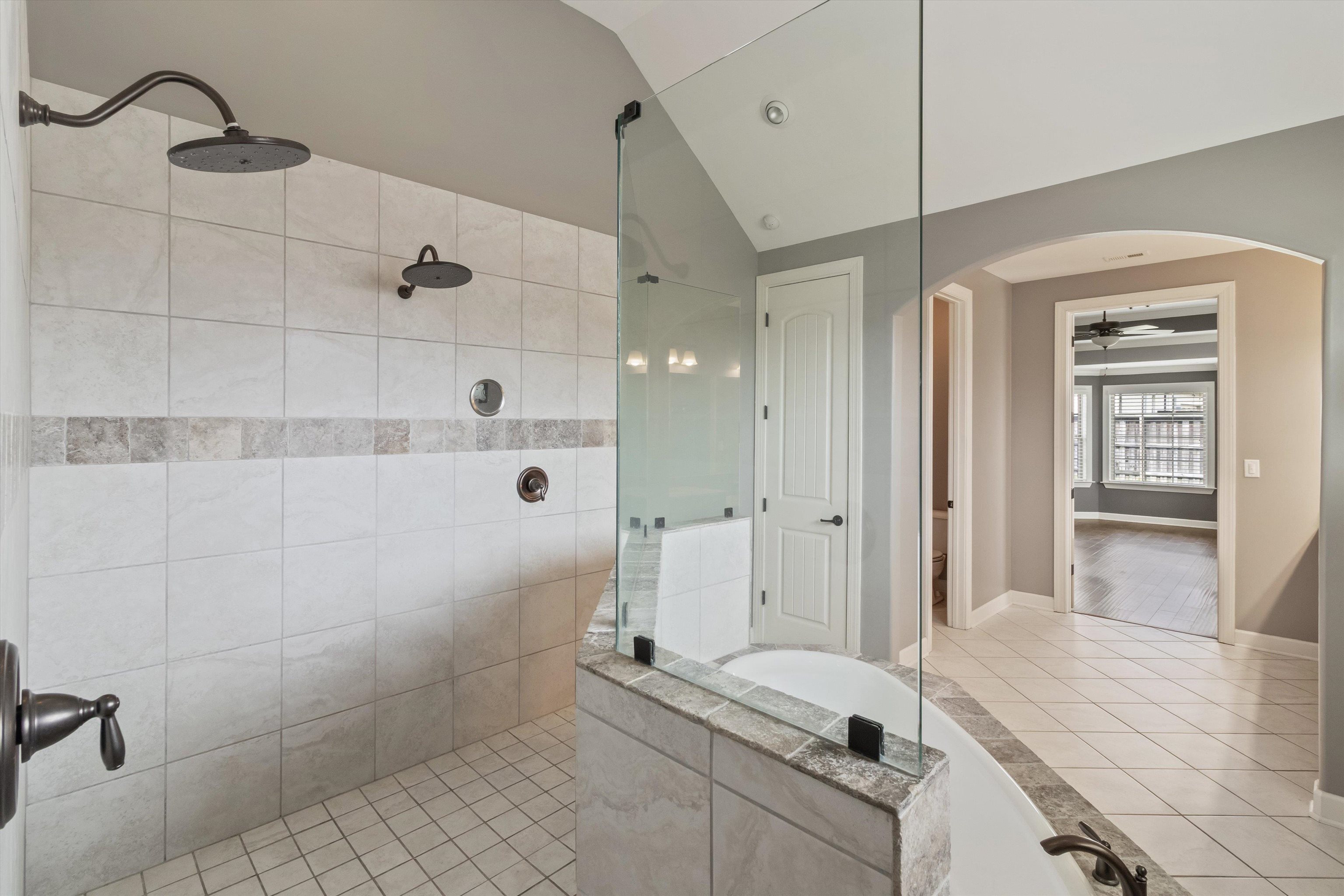 3449 Banyan Lane Bartlett, TN 38133 - Photo 25 of 35 a spacious bathroom with a granite countertop sink a toilet and shower