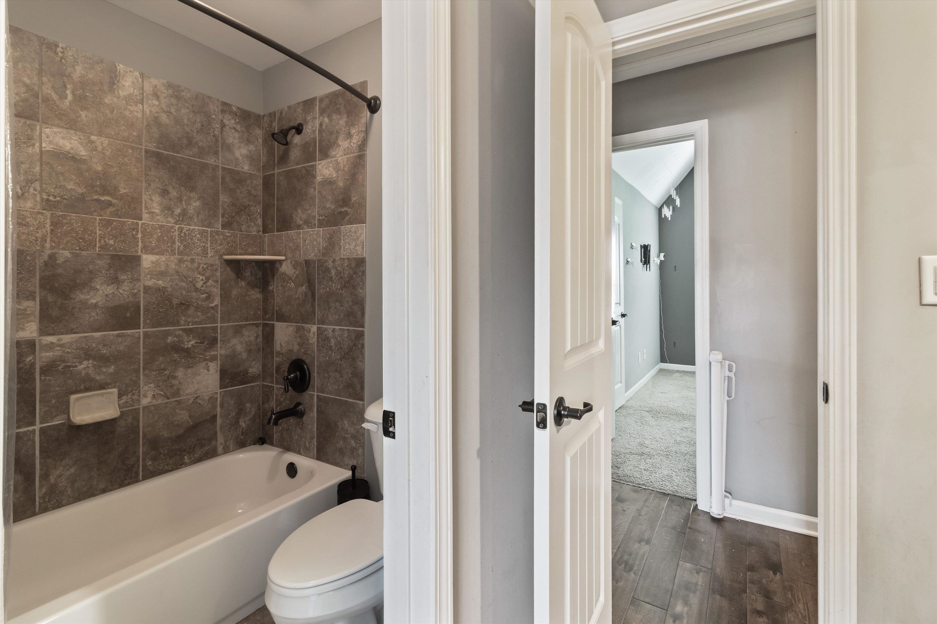 3449 Banyan Lane Bartlett, TN 38133 - Photo 29 of 35 a bathroom with a bathtub shower sink vanity and toilet