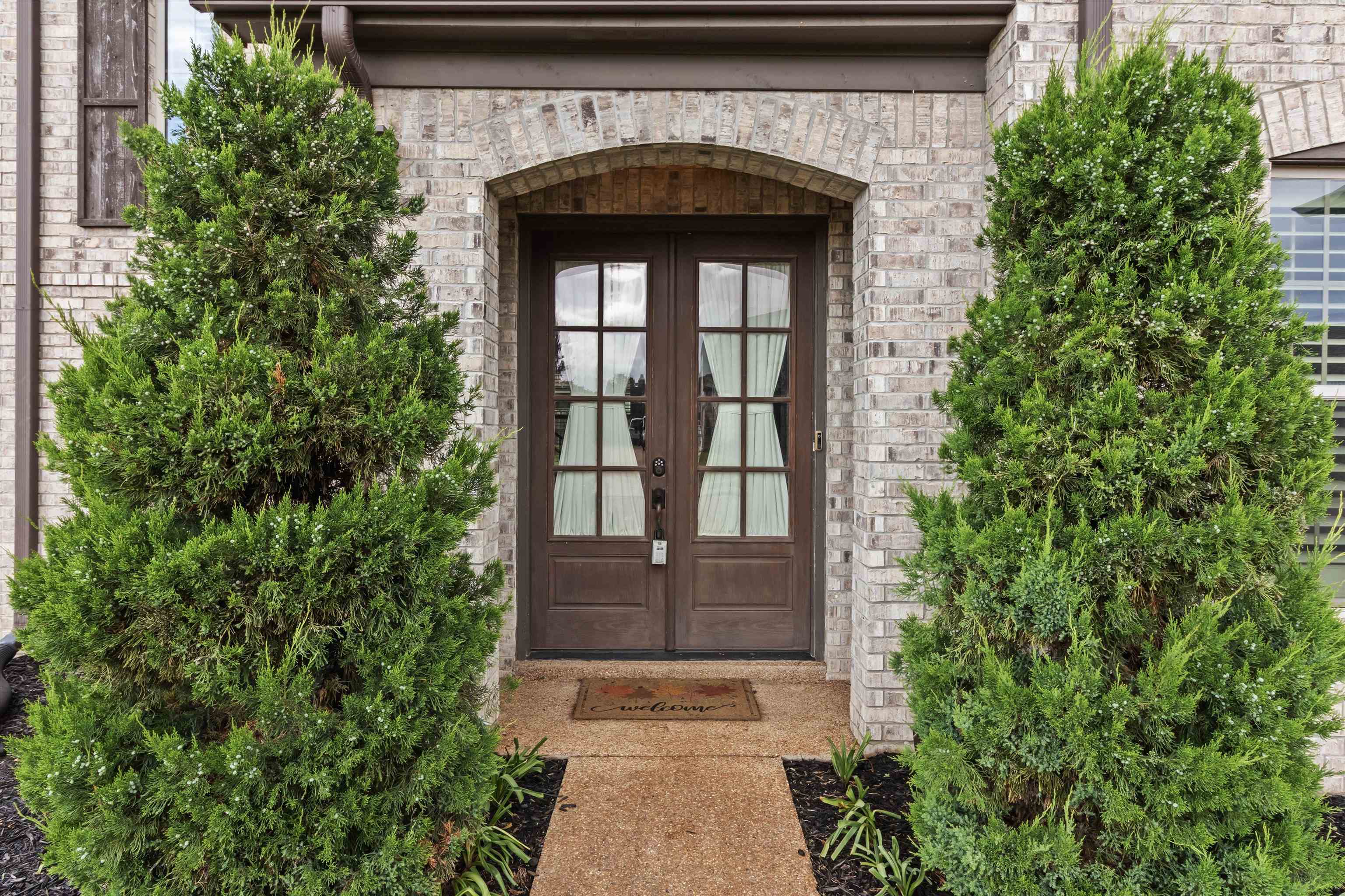 3449 Banyan Lane Bartlett, TN 38133 - Photo 3 of 35 a front view of a house with a yard