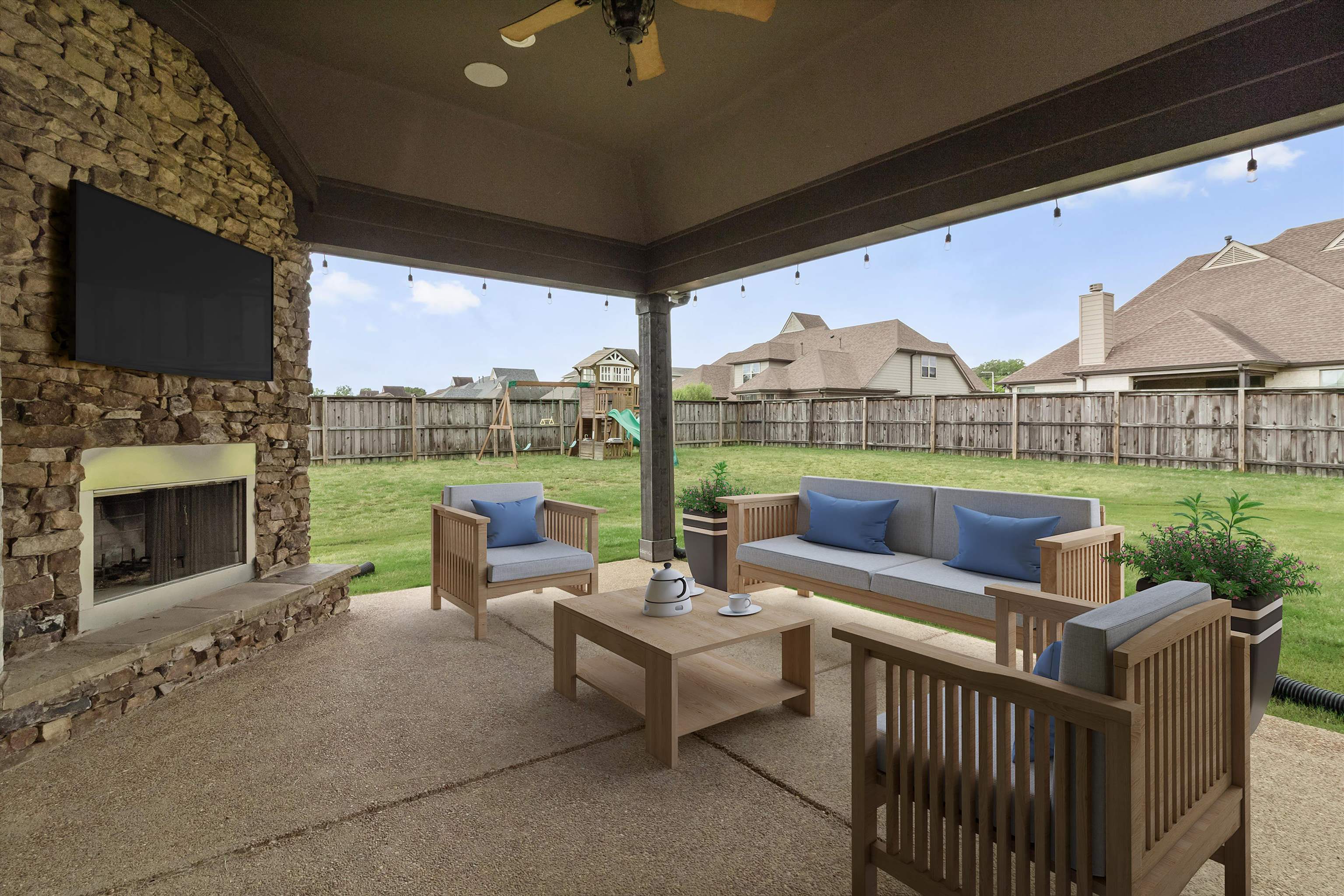 3449 Banyan Lane Bartlett, TN 38133 - Photo 34 of 35 a view of a patio with couches potted plants and a fireplace