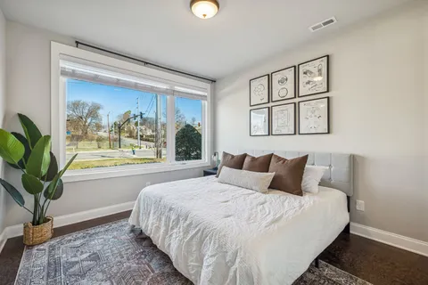 a living room with furniture wooden floor and a flat screen tv
