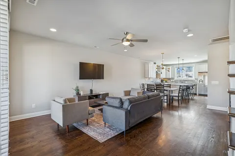 a view of a dining room with furniture and wooden floor