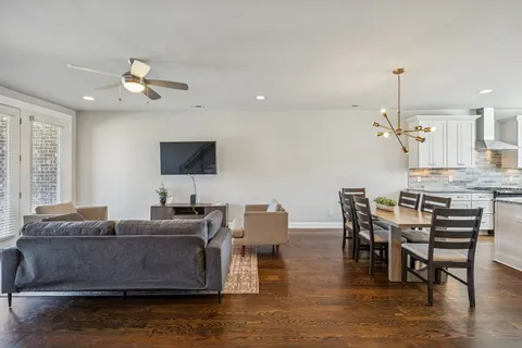 a bedroom with furniture and a chandelier