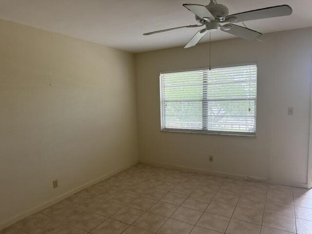 660 Glouchester Street, Unit 206 Boca Raton, FL 33487 - Photo 9 of 13 a view of an empty room with a window