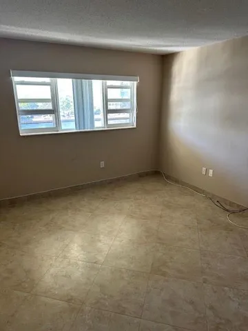 en empty room with windows