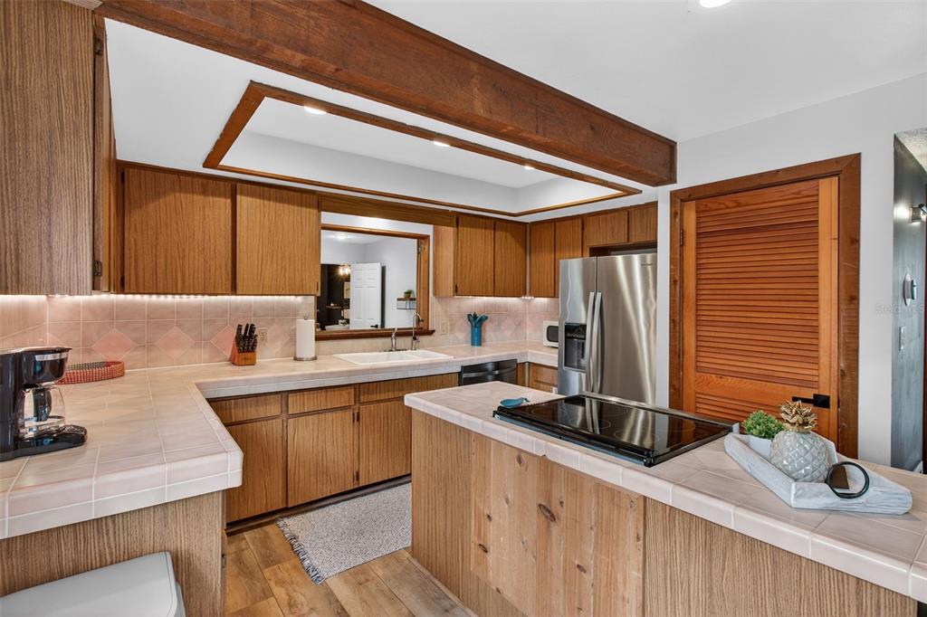 4925 Hamilton Road Lakeland, FL 33811 - Photo 13 of 71 a kitchen with a sink cabinets and window