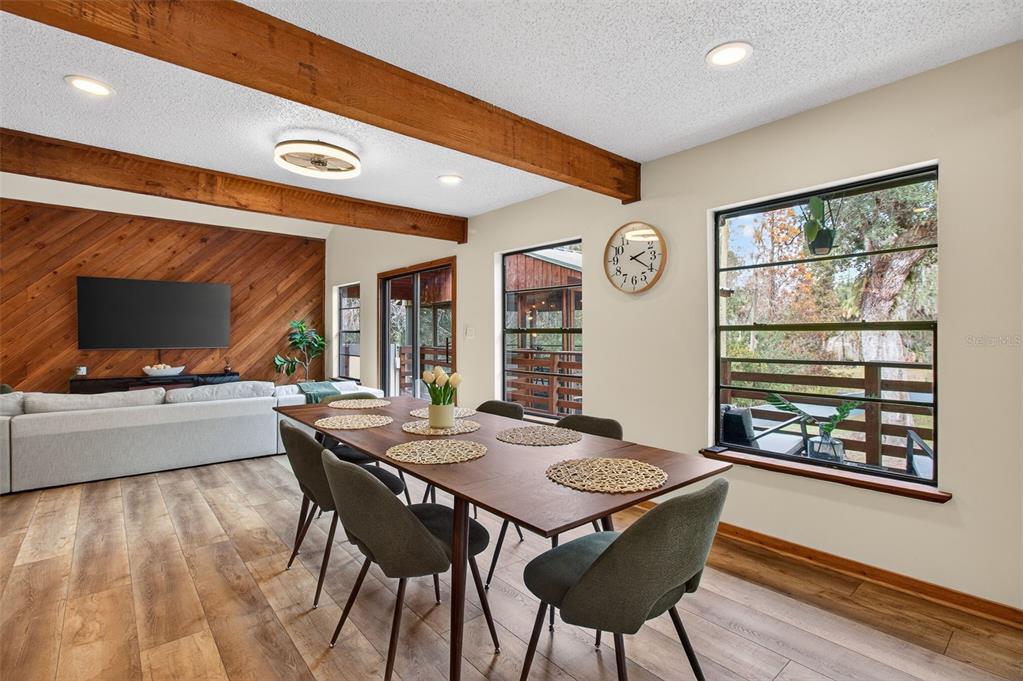 4925 Hamilton Road Lakeland, FL 33811 - Photo 15 of 71 a view of a dining room with furniture window and wooden floor