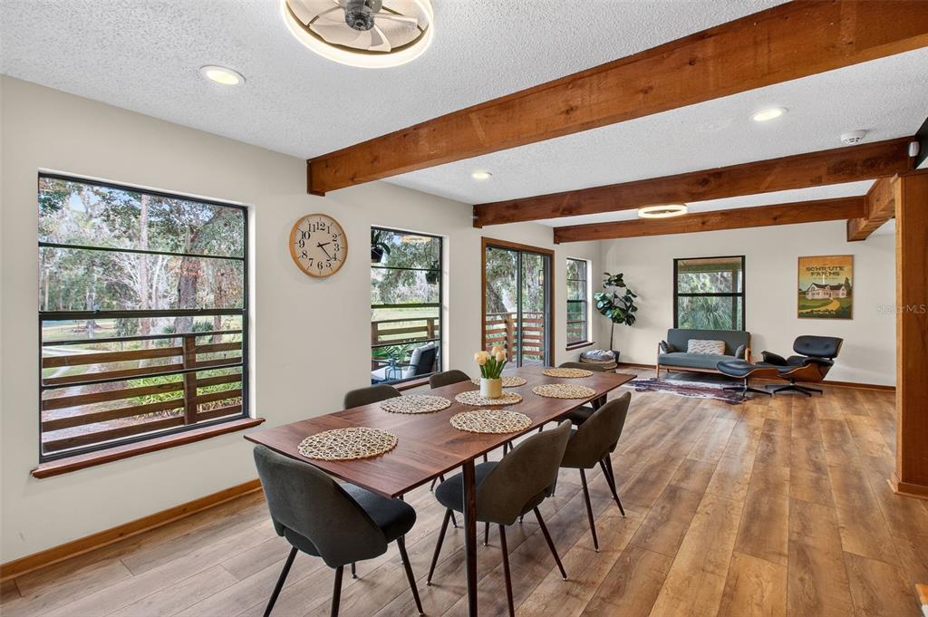 4925 Hamilton Road Lakeland, FL 33811 - Photo 19 of 71 a view of a dining room with furniture window and wooden floor