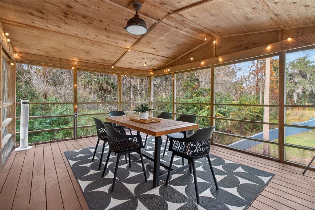 4925 Hamilton Road Lakeland, FL 33811 - Photo 28 of 71 a view of a porch with furniture and wooden floor