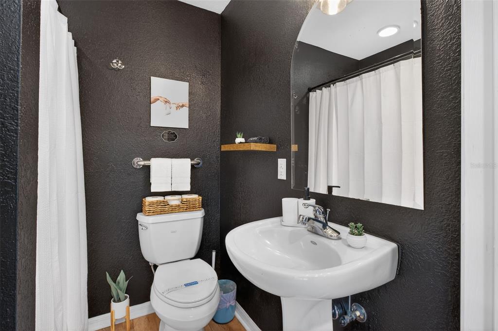 4925 Hamilton Road Lakeland, FL 33811 - Photo 36 of 71 a bathroom with a toilet sink and mirror