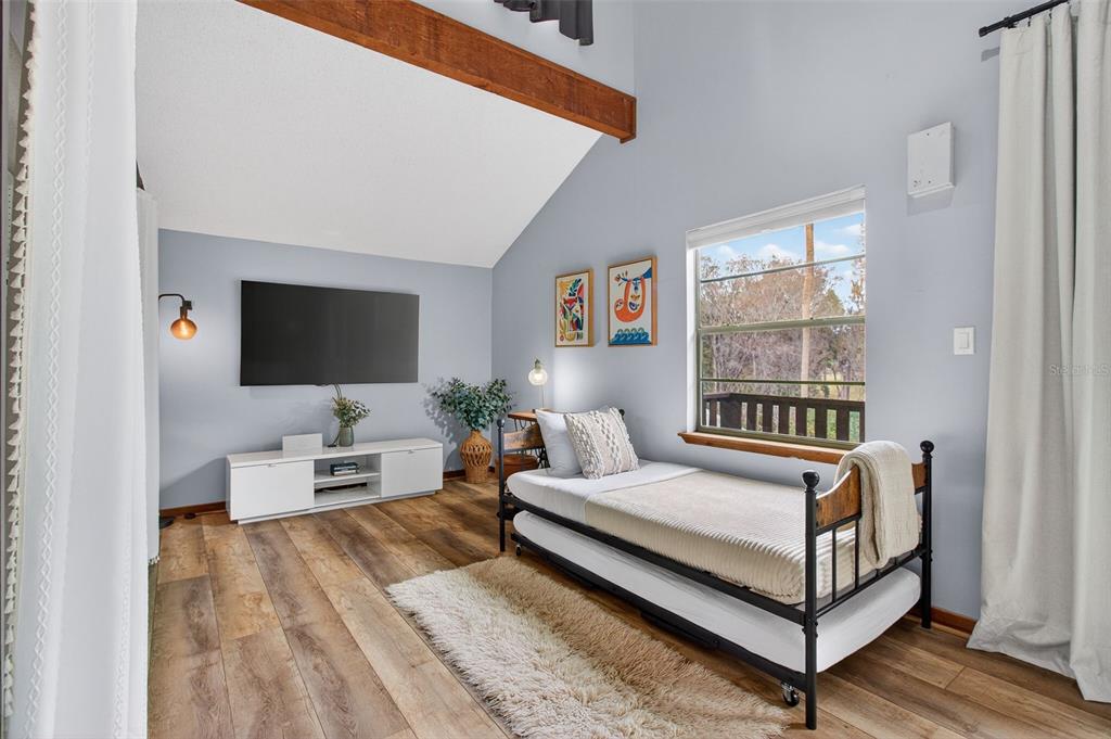 4925 Hamilton Road Lakeland, FL 33811 - Photo 45 of 71 a bedroom with a bed and a flat screen tv